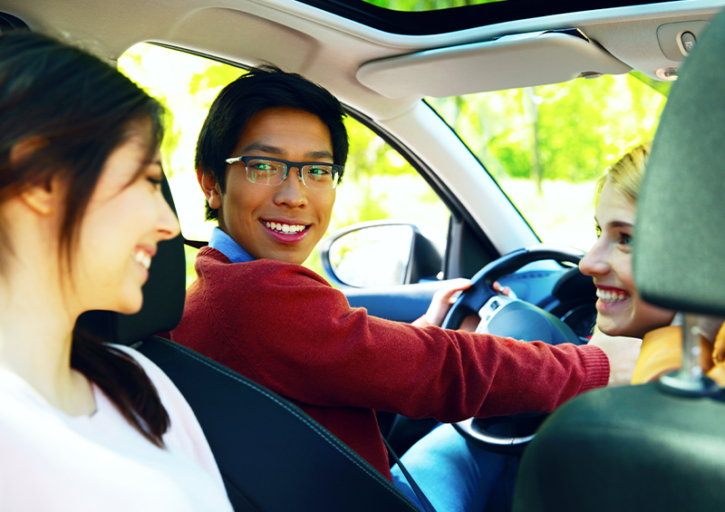 young man driving a car